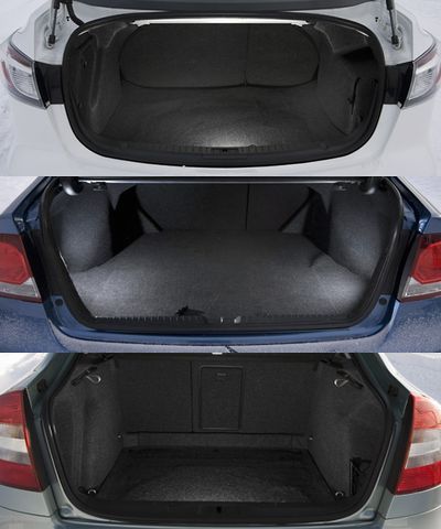 Самый удобный доступ к багажному отделению, конечно, у Шкоды (на фото снизу). Пятая дверь открывается вместе со стеклом и доступ к 560 литрам багажника ничем не ограничен. И это если не складывать задние сиденья, а то будут все 1350 литров. Оппоненты в этой номинации Шкоде не соперники. Они классические седаны, поэтому заднее стекло приделано намертво, да и объёмы не те. В Мазде — 430 литров, а в Хонде и того меньше — всего 389 литров. К тому же доступ к багажному пространству и Хонды, и Мазды сильно ограничен узким проёмом